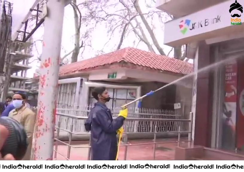 Srinagar Municipal Corporation workers sanitize different areas in Srinagar in view of Corona Virus Pandemic