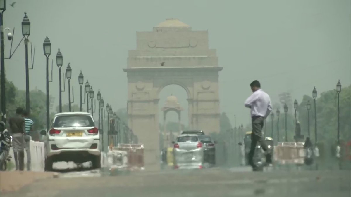 People Cover Their Heads As Mercury Touches 42 Degrees Celsius In Delhi