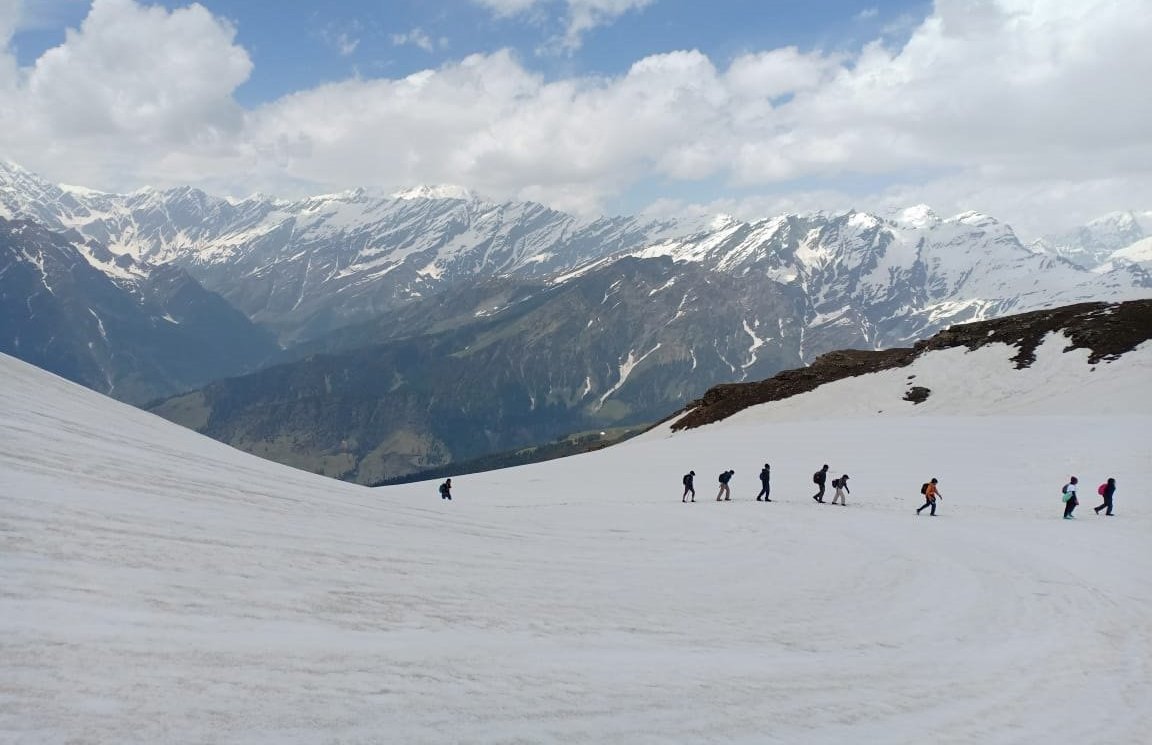 Tourists Enjoy Snow Clad Mountains Near The Frozen Bhrigu Lake