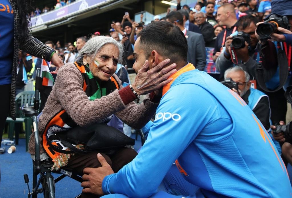 Indian Players With An 87 Year Old Fan After Winning The Match Against Bangladesh