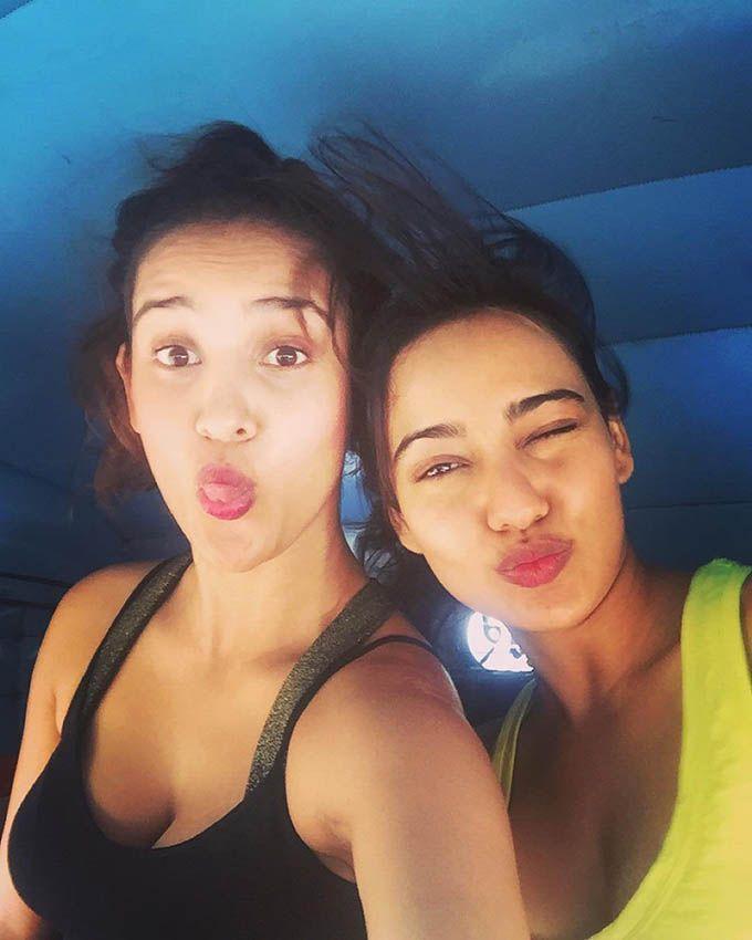 Neha Sharma Relaxing In Beach Photos