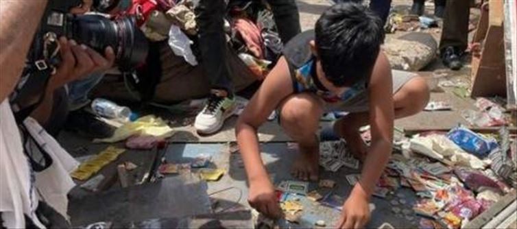 A Boy collected Coins from his Dad's Demolished Shop