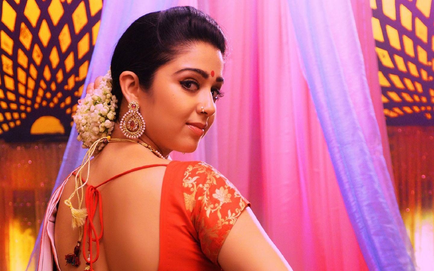 Cute And Beautiful Saree Stills Of Heroine Charmi Kaur