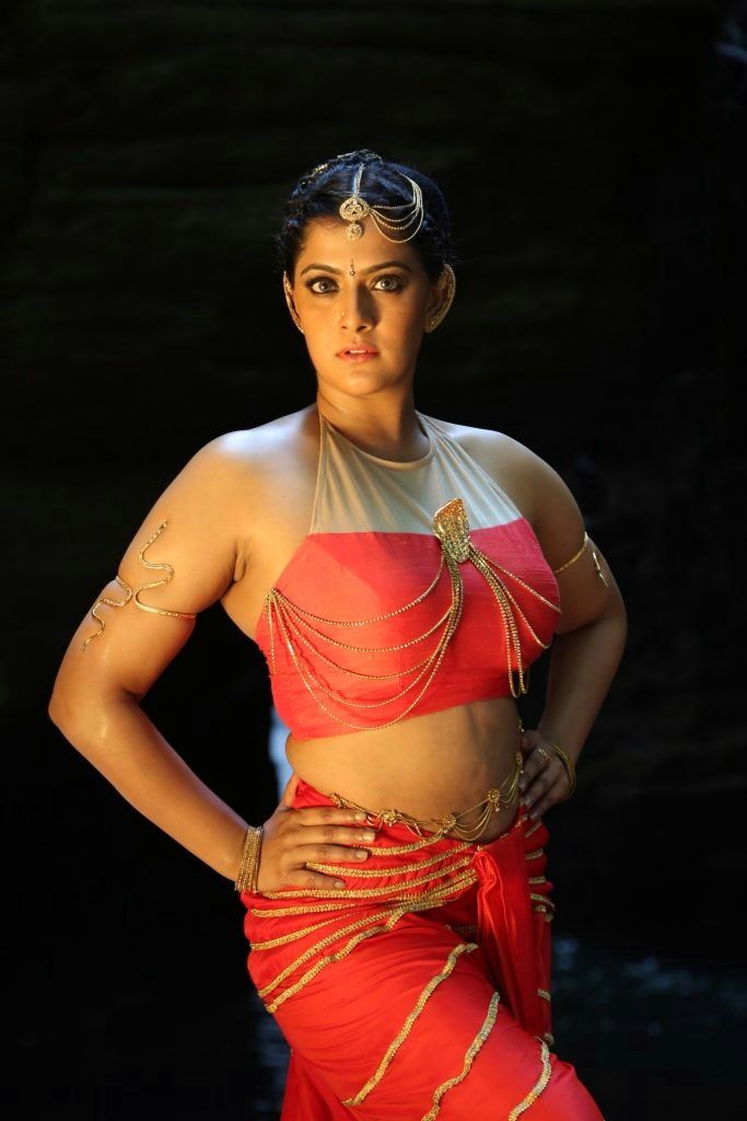 Varalaxmi Hot Stills from Neeyaa 2 Movie