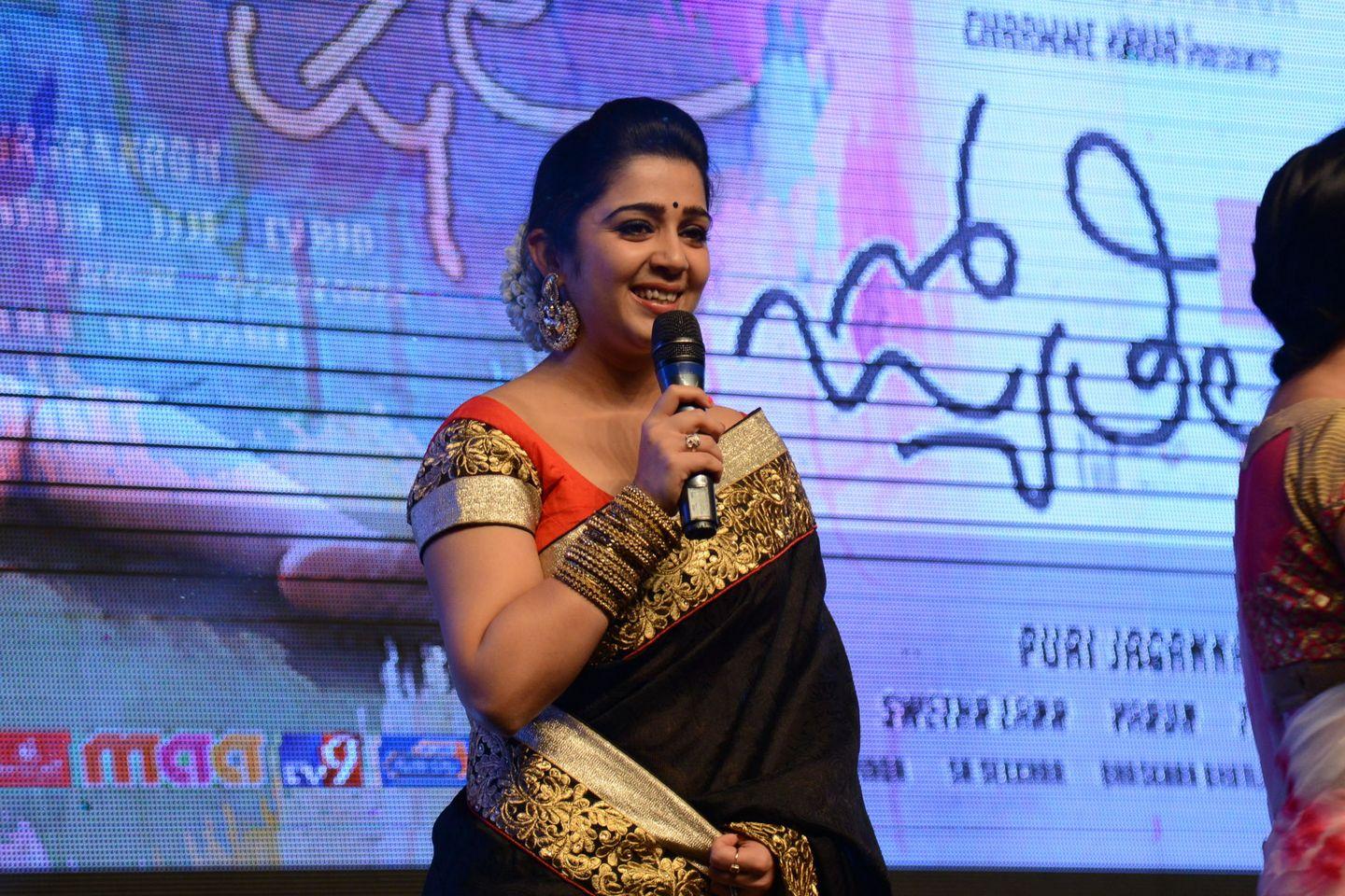 charmy kaur Stills At Jyothi Lakshmi Audio Launch Pics