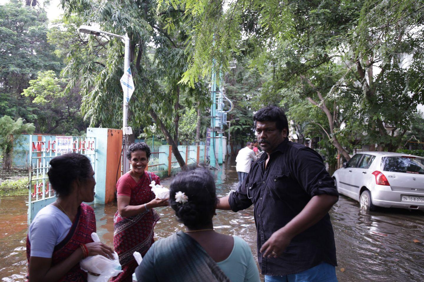 Actor Parthiban doing Flood Relief Activities