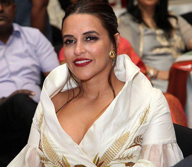 Neha Dhupia Exposing Her Huge Cleavage With Smile Photos