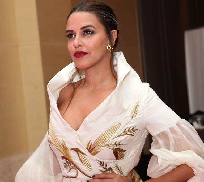 Neha Dhupia Exposing Her Huge Cleavage With Smile Photos