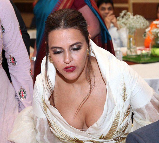 Neha Dhupia Exposing Her Huge Cleavage With Smile Photos