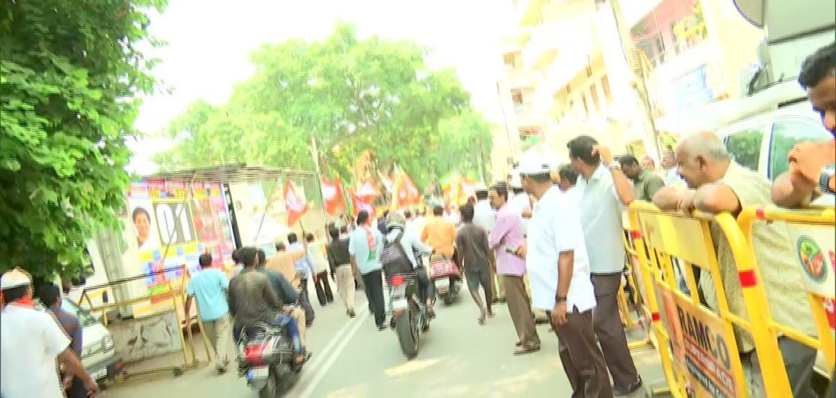 BJP members celebrate outside their HQ in Bengaluru