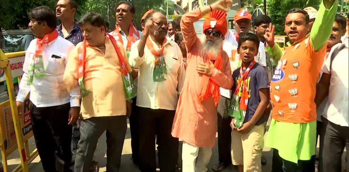 BJP members celebrate outside their HQ in Bengaluru