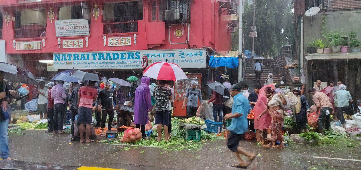 PHOTOS: Visuals of heavy rain & waterlogged streets from Mumbai's