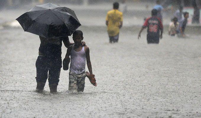 PHOTOS: Visuals of heavy rain & waterlogged streets from Mumbai's