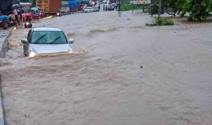 PHOTOS: Visuals of heavy rain & waterlogged streets from Mumbai's