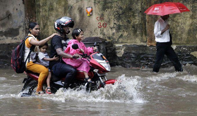 PHOTOS: Visuals of heavy rain & waterlogged streets from Mumbai's