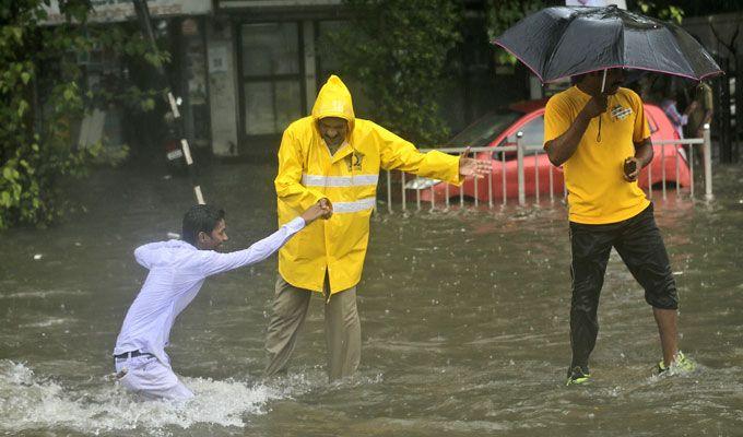 PHOTOS: Visuals of heavy rain & waterlogged streets from Mumbai's