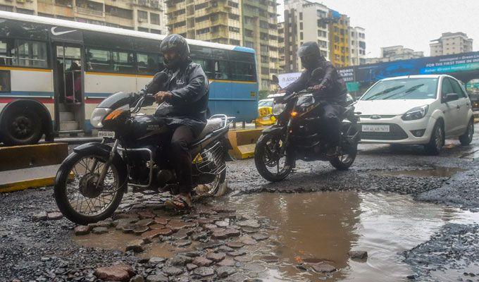 PHOTOS: Visuals of heavy rain & waterlogged streets from Mumbai's