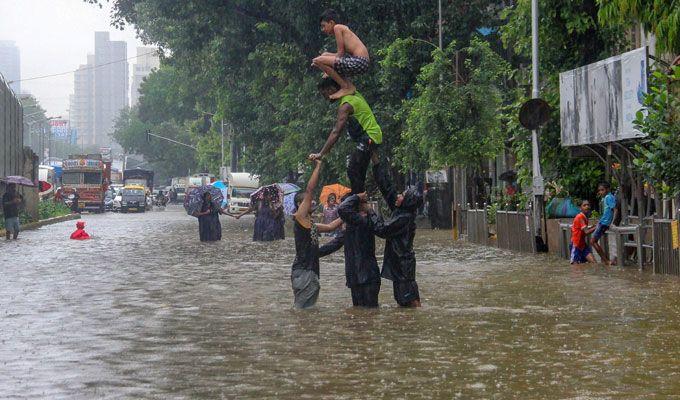 PHOTOS: Visuals of heavy rain & waterlogged streets from Mumbai's