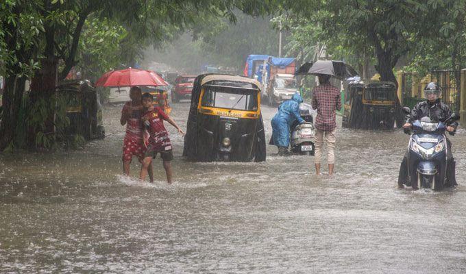 PHOTOS: Visuals of heavy rain & waterlogged streets from Mumbai's