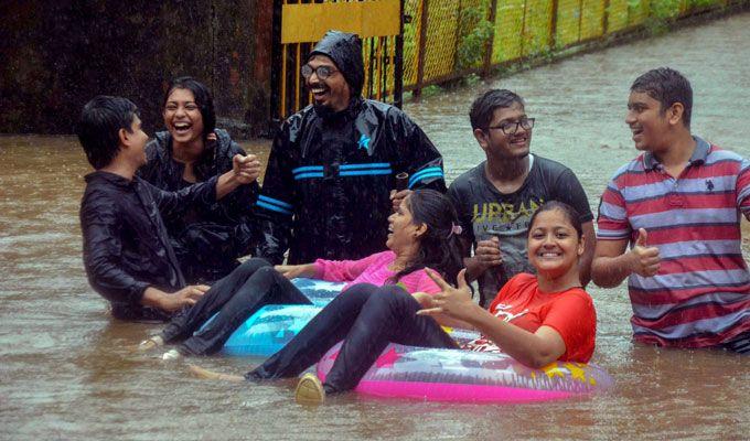 PHOTOS: Visuals of heavy rain & waterlogged streets from Mumbai's