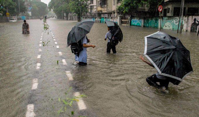 PHOTOS: Visuals of heavy rain & waterlogged streets from Mumbai's