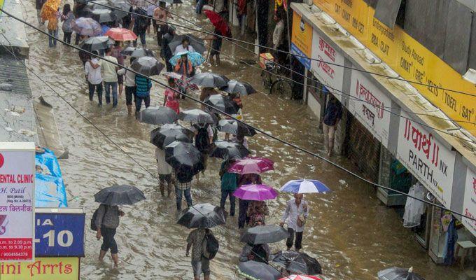 PHOTOS: Visuals of heavy rain & waterlogged streets from Mumbai's