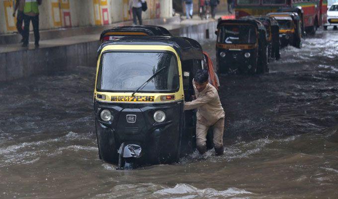 PHOTOS: Visuals of heavy rain & waterlogged streets from Mumbai's