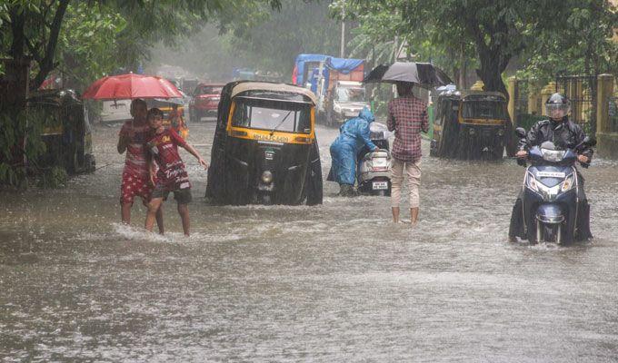 PHOTOS: Visuals of heavy rain & waterlogged streets from Mumbai's