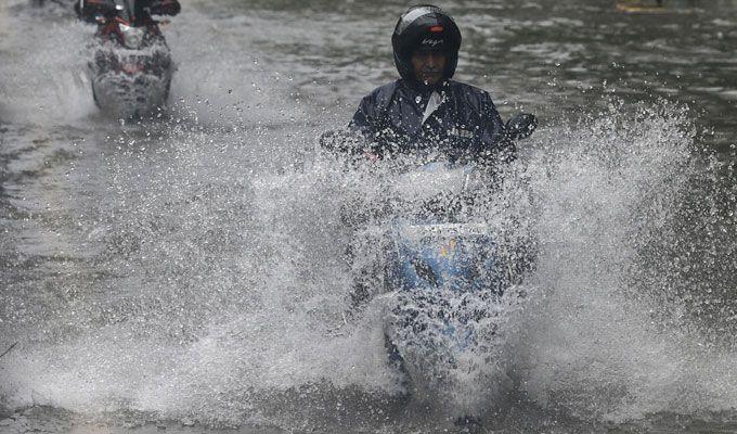 PHOTOS: Visuals of heavy rain & waterlogged streets from Mumbai's