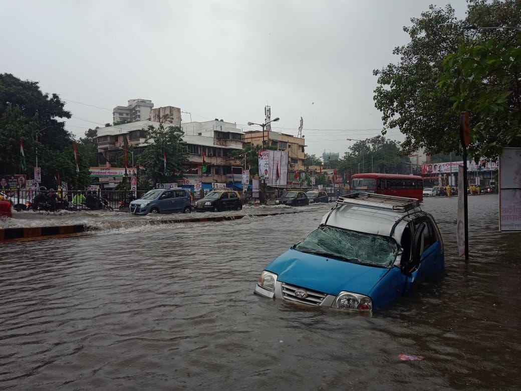 PHOTOS: Visuals of heavy rain & waterlogged streets from Mumbai's