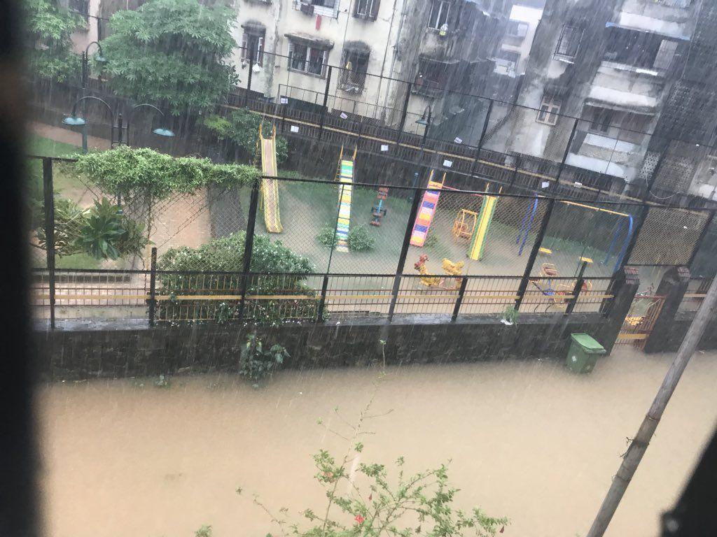 PHOTOS: Visuals of heavy rain & waterlogged streets from Mumbai's