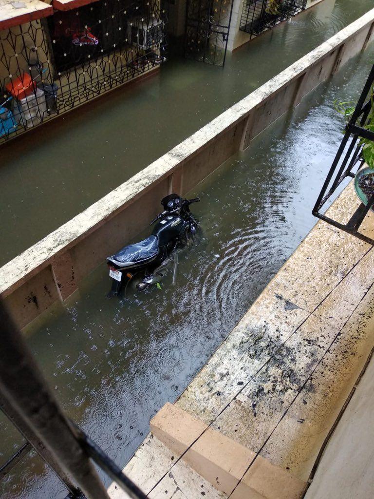 PHOTOS: Visuals of heavy rain & waterlogged streets from Mumbai's