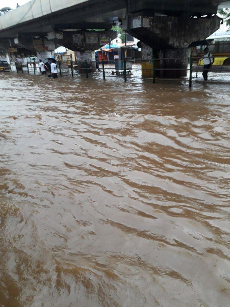 PHOTOS: Visuals of heavy rain & waterlogged streets from Mumbai's