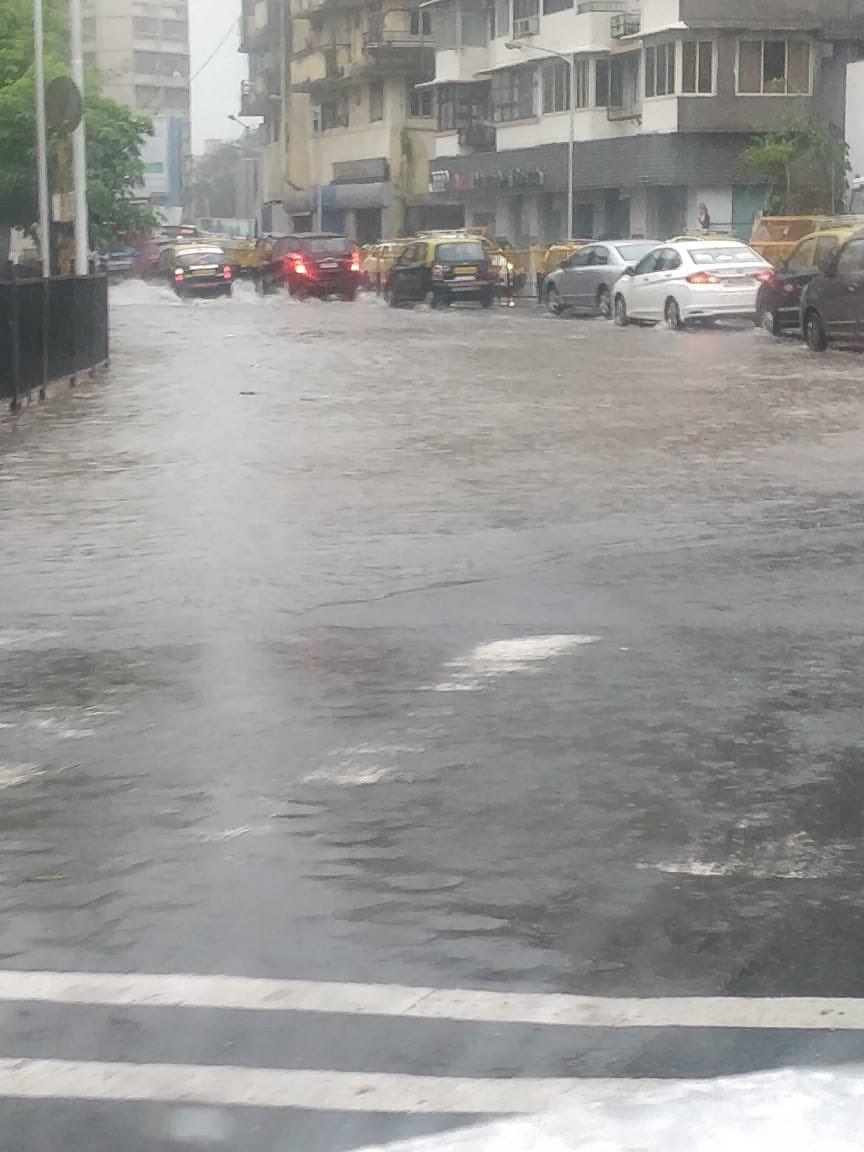 PHOTOS: Visuals of heavy rain & waterlogged streets from Mumbai's