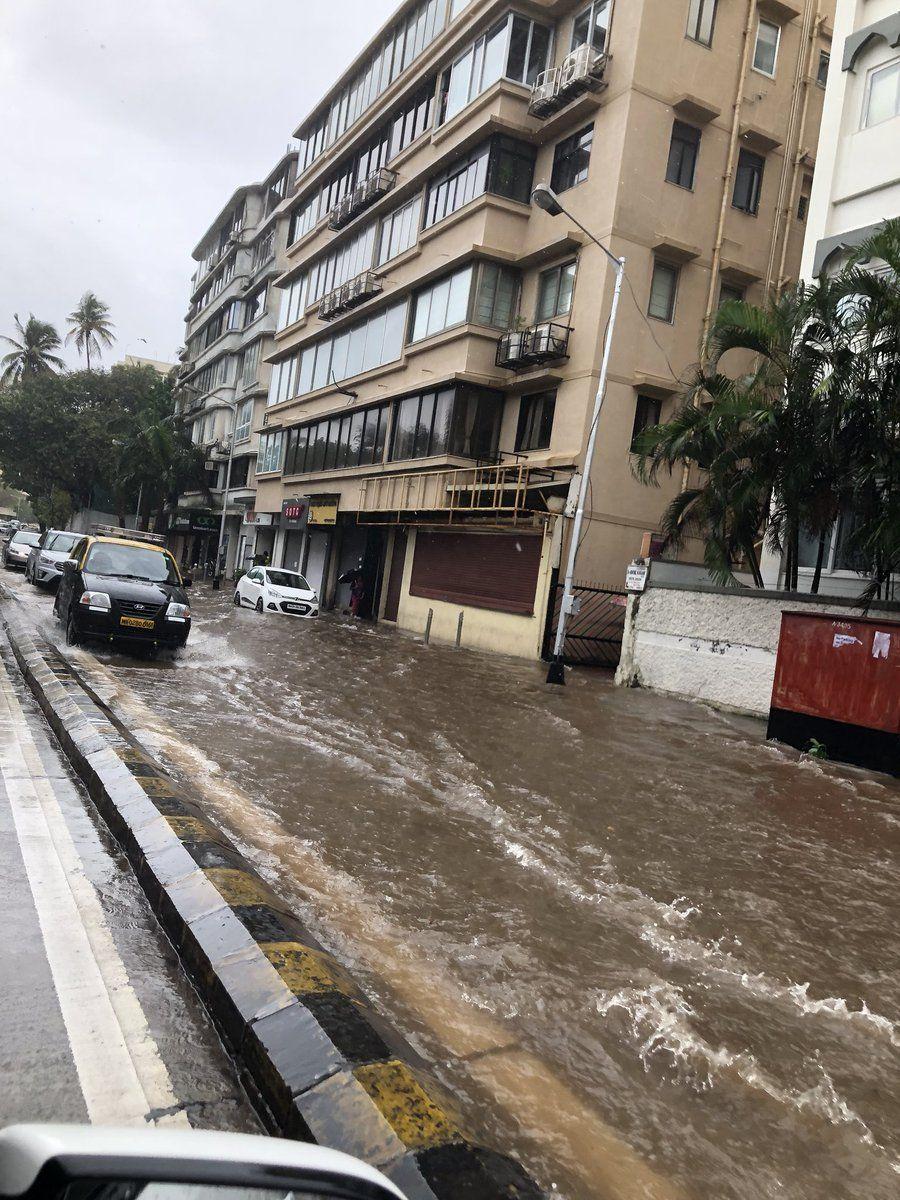 PHOTOS: Visuals of heavy rain & waterlogged streets from Mumbai's