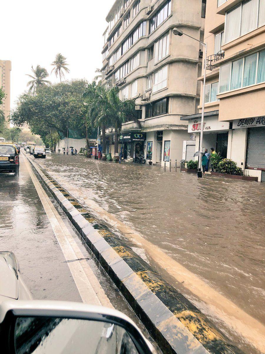 PHOTOS: Visuals of heavy rain & waterlogged streets from Mumbai's