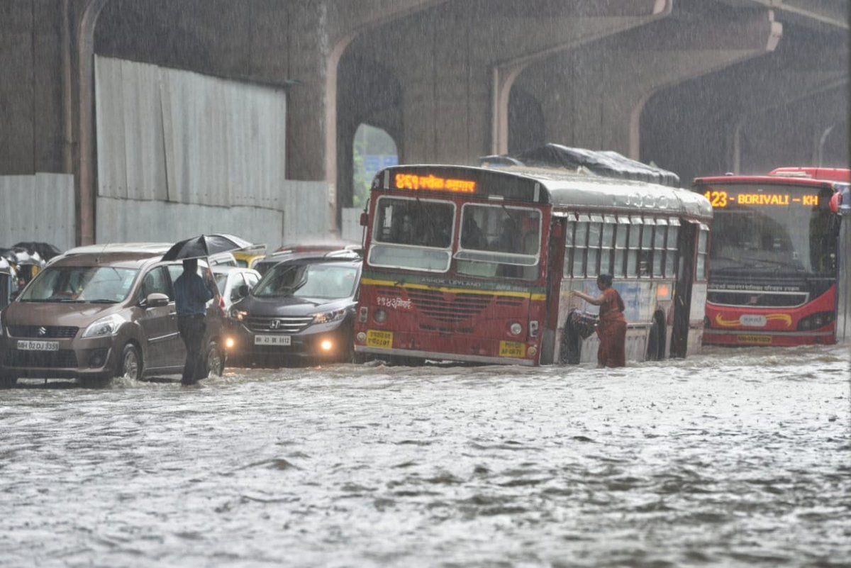 PHOTOS: Visuals of heavy rain & waterlogged streets from Mumbai's