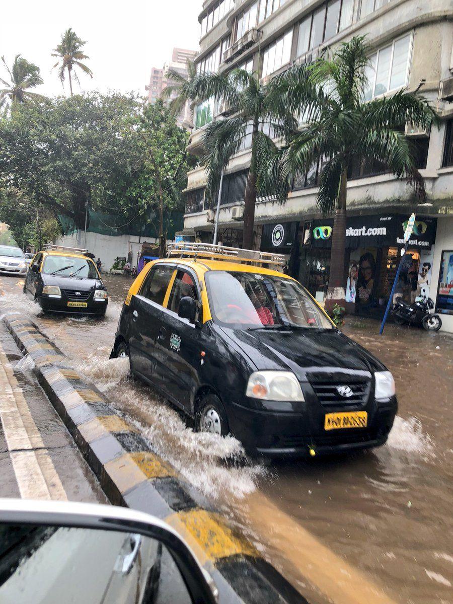 PHOTOS: Visuals of heavy rain & waterlogged streets from Mumbai's