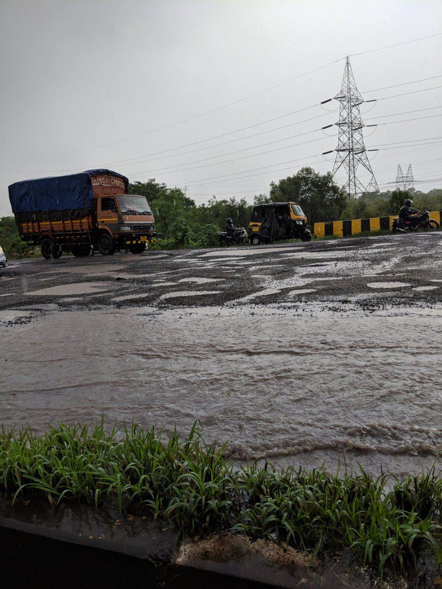 PHOTOS: Visuals of heavy rain & waterlogged streets from Mumbai's