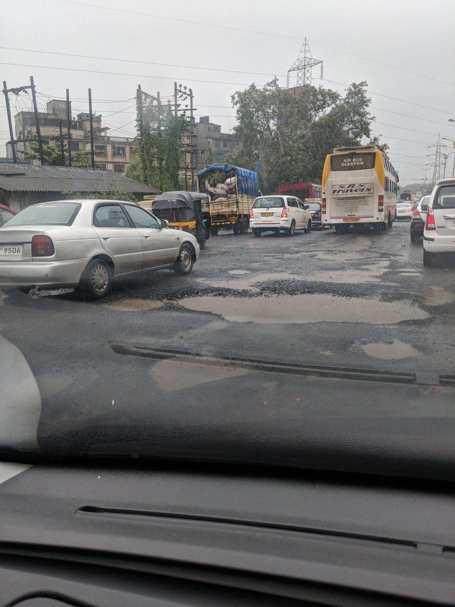 PHOTOS: Visuals of heavy rain & waterlogged streets from Mumbai's