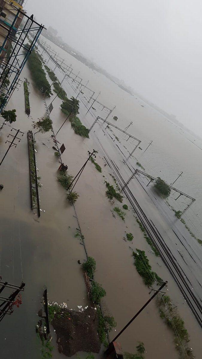 PHOTOS: Visuals of heavy rain & waterlogged streets from Mumbai's