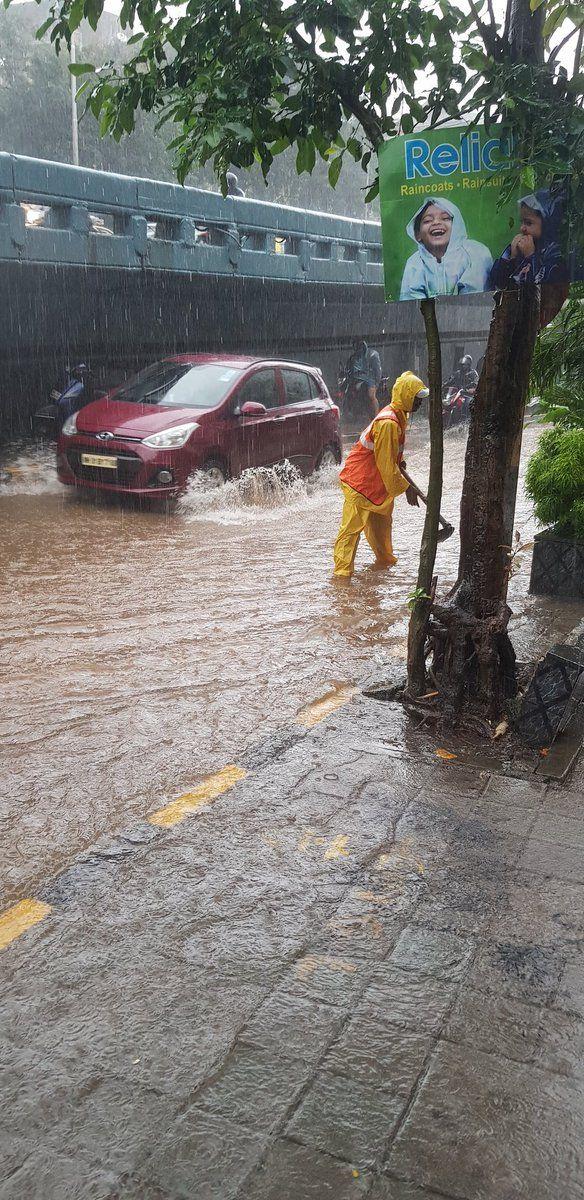 PHOTOS: Visuals of heavy rain & waterlogged streets from Mumbai's