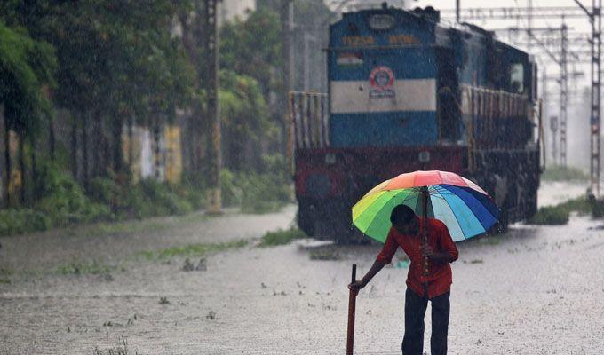 PHOTOS: Visuals of heavy rain & waterlogged streets from Mumbai's