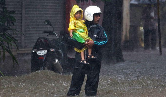 PHOTOS: Visuals of heavy rain & waterlogged streets from Mumbai's