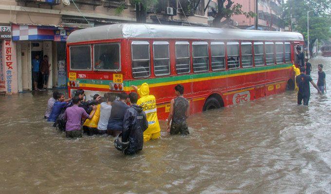 PHOTOS: Visuals of heavy rain & waterlogged streets from Mumbai's