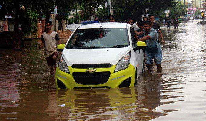 PHOTOS: Visuals of heavy rain & waterlogged streets from Odisha