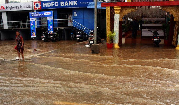 PHOTOS: Visuals of heavy rain & waterlogged streets from Odisha