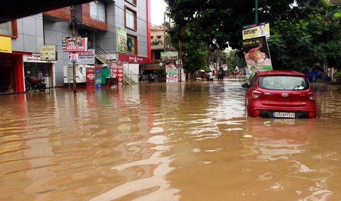 PHOTOS: Visuals of heavy rain & waterlogged streets from Odisha