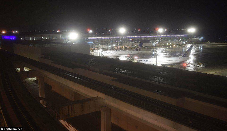 Planes floating on flooded tarmac at Houston airport