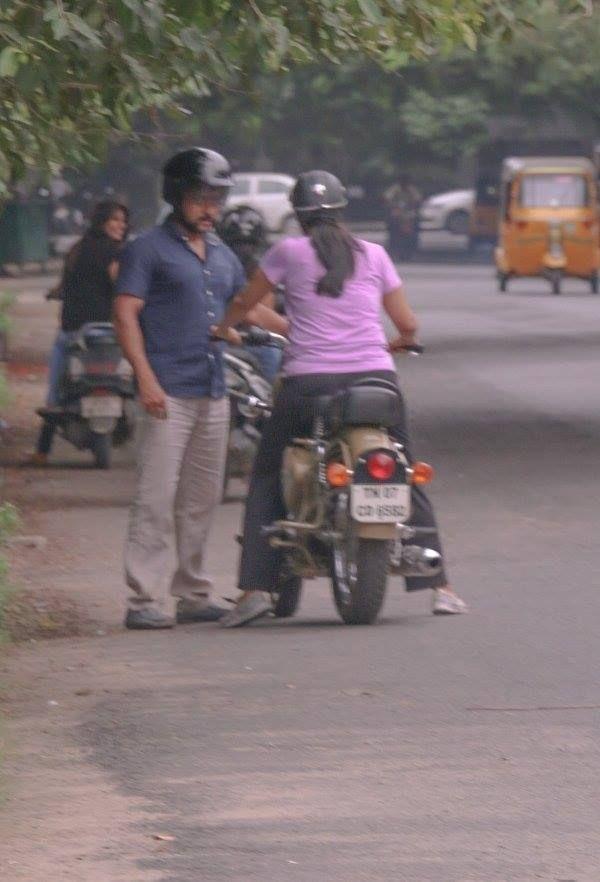 Surya teaching Jyothika to ride a bike Photos